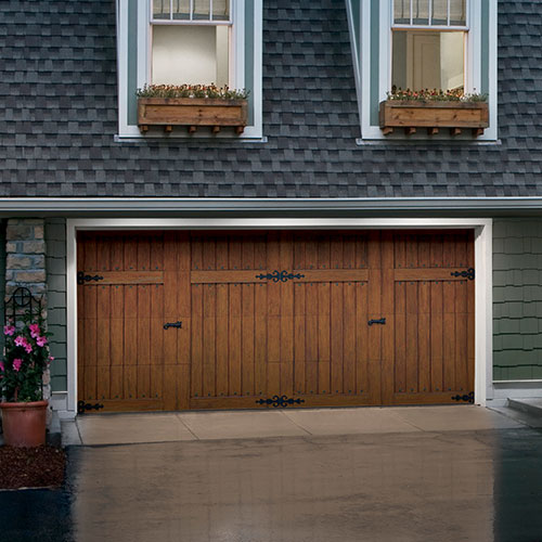 A beautiful garage door, like this brown wooden one, can really boost your home’s curb appeal — and resale value.